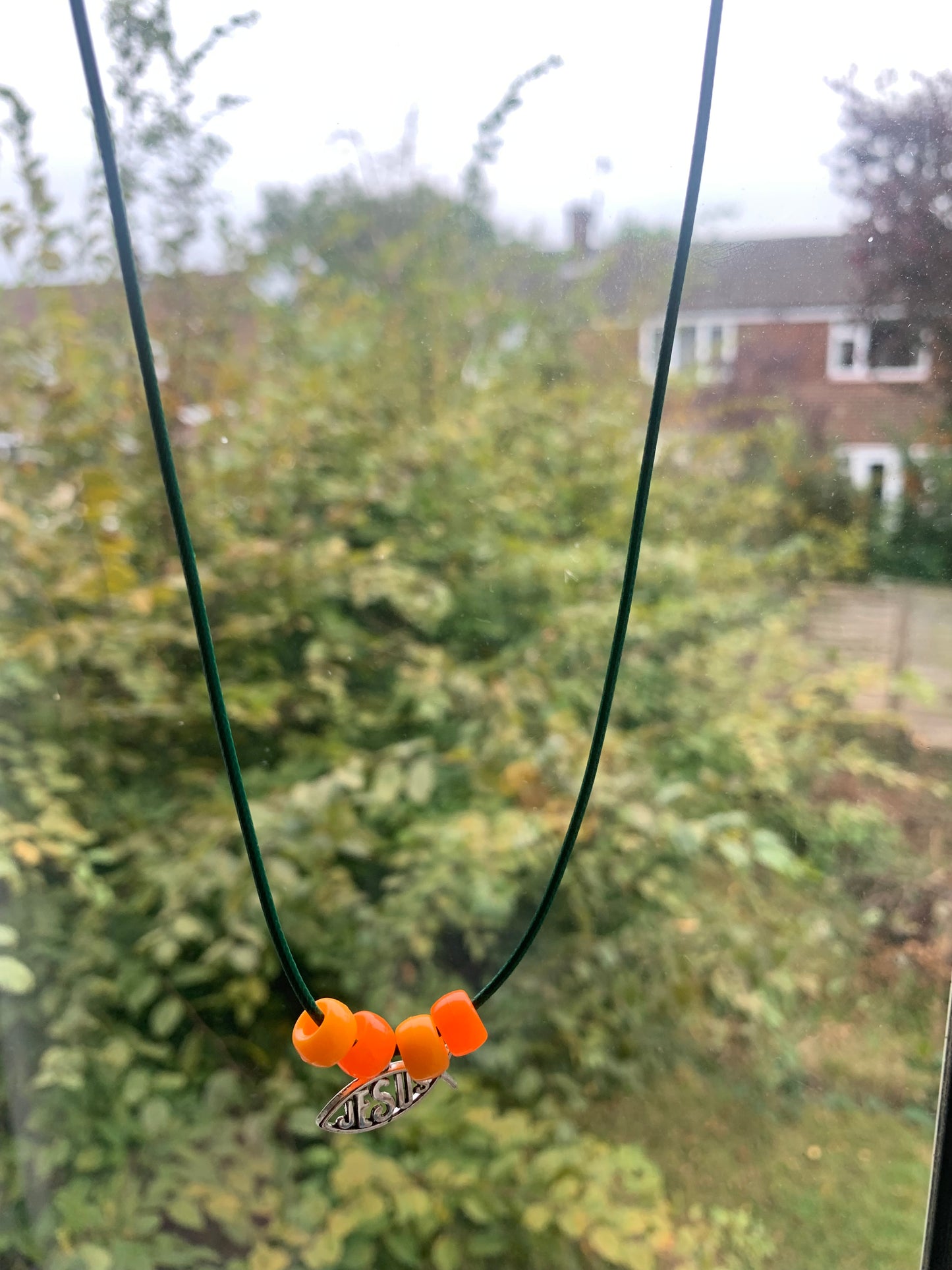 Green cord Jesus necklace