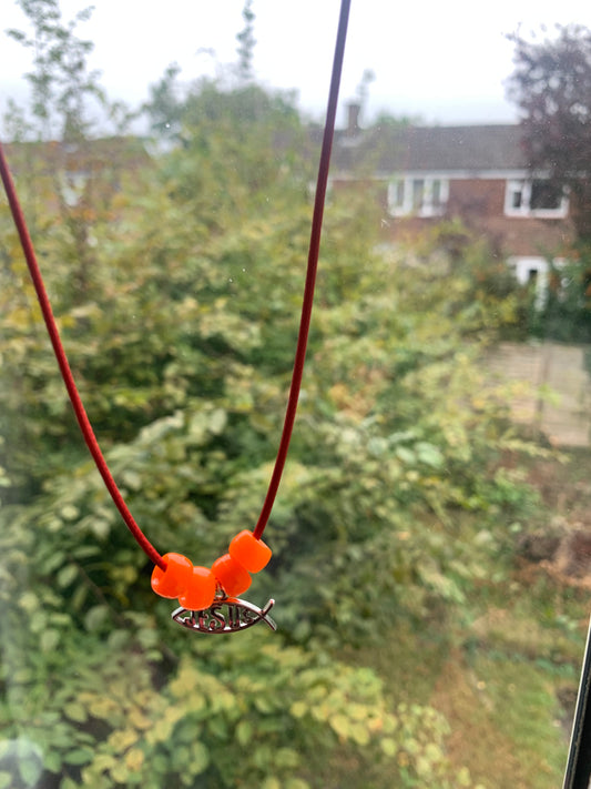 Red cord Jesus necklace