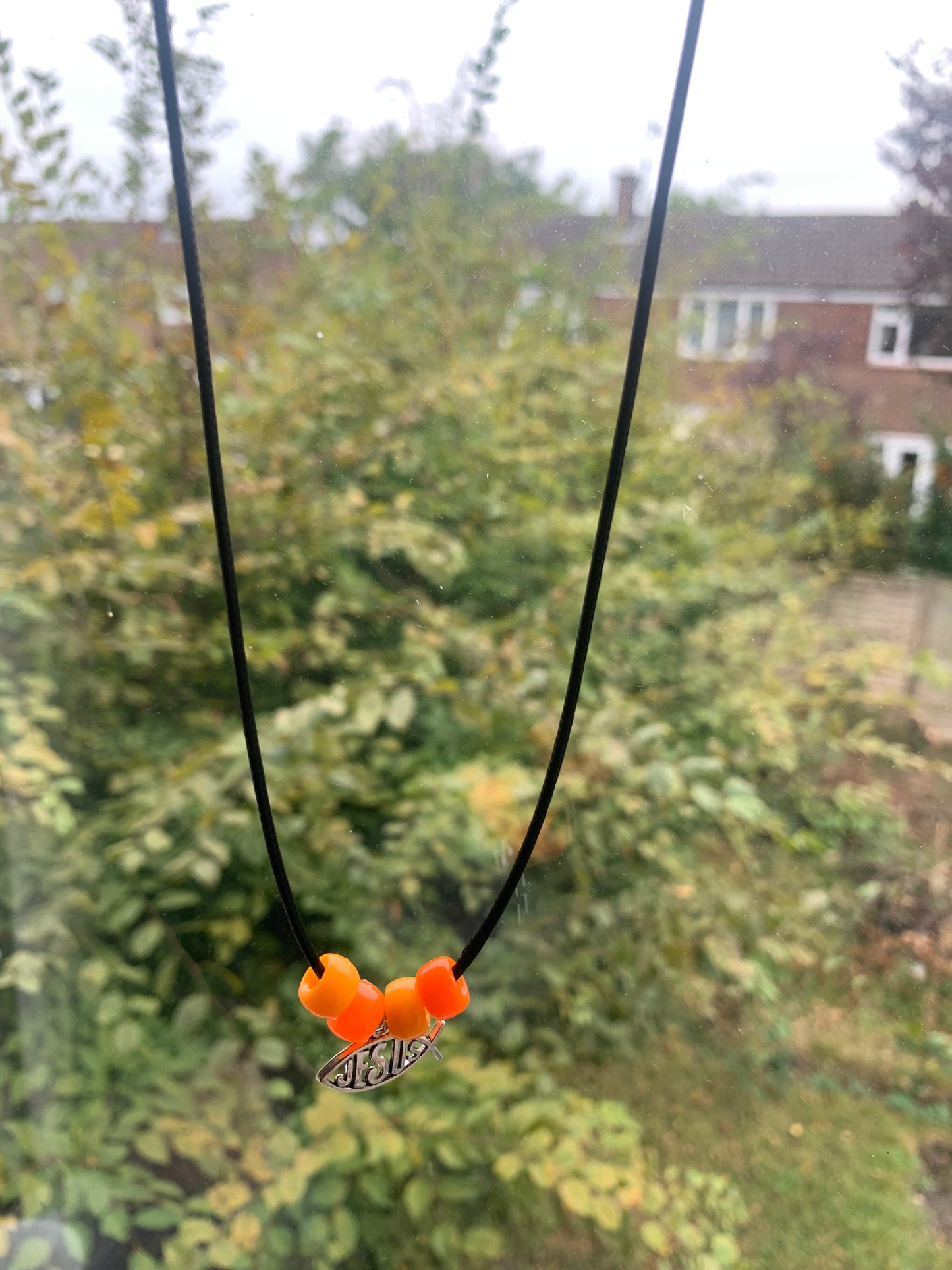 Black cord Jesus necklace